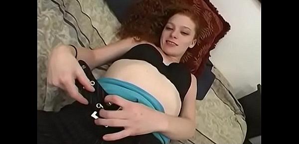  Redhead amateur temptress plays with her shaved love tube